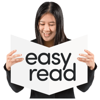 A person reading from a white book that says easy read